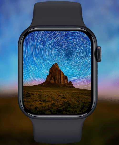 Swirling Star Trails Over Rock Formation