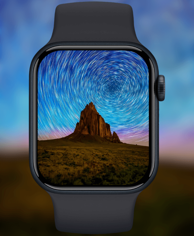 swirling-star-trails-over-rock-formation