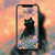 black cat in pastel meadow